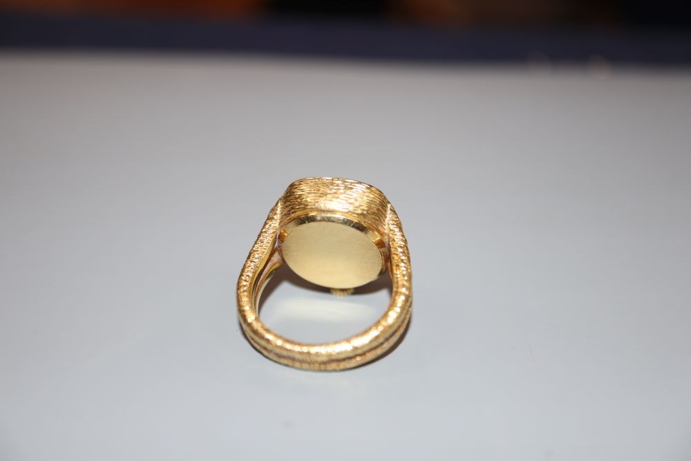 A ladys 1970s? textured 18ct gold Bueche Girod ring watch, size J/K, gross 18.6 grams.